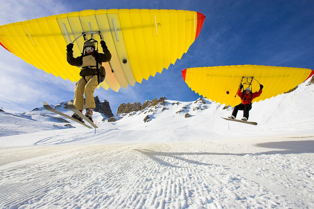 Snowboarder and skier using Woop-Jump, Grimentz, Valais, Switzerland