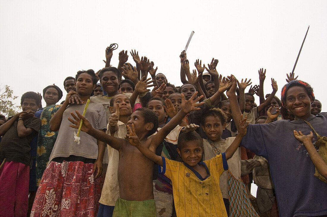 A group of cheering children, Langila, Papua New Guinea, Oceania