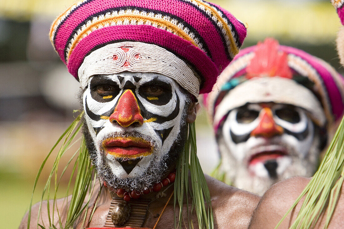 Men with facial painting at Singsing Dance, Lae, Papua New Guinea, Oceania
