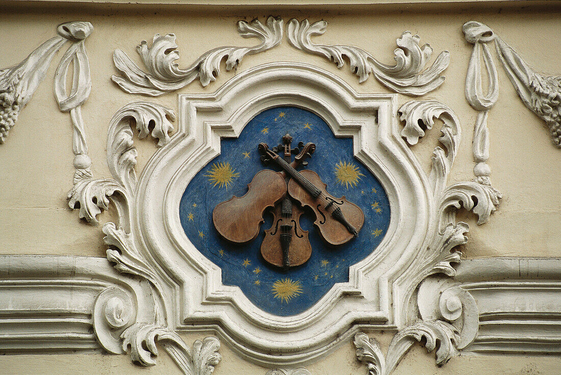House sign in Nerudova Street, the Three Fiddles . Malá Strana. Prague. Czech Republic