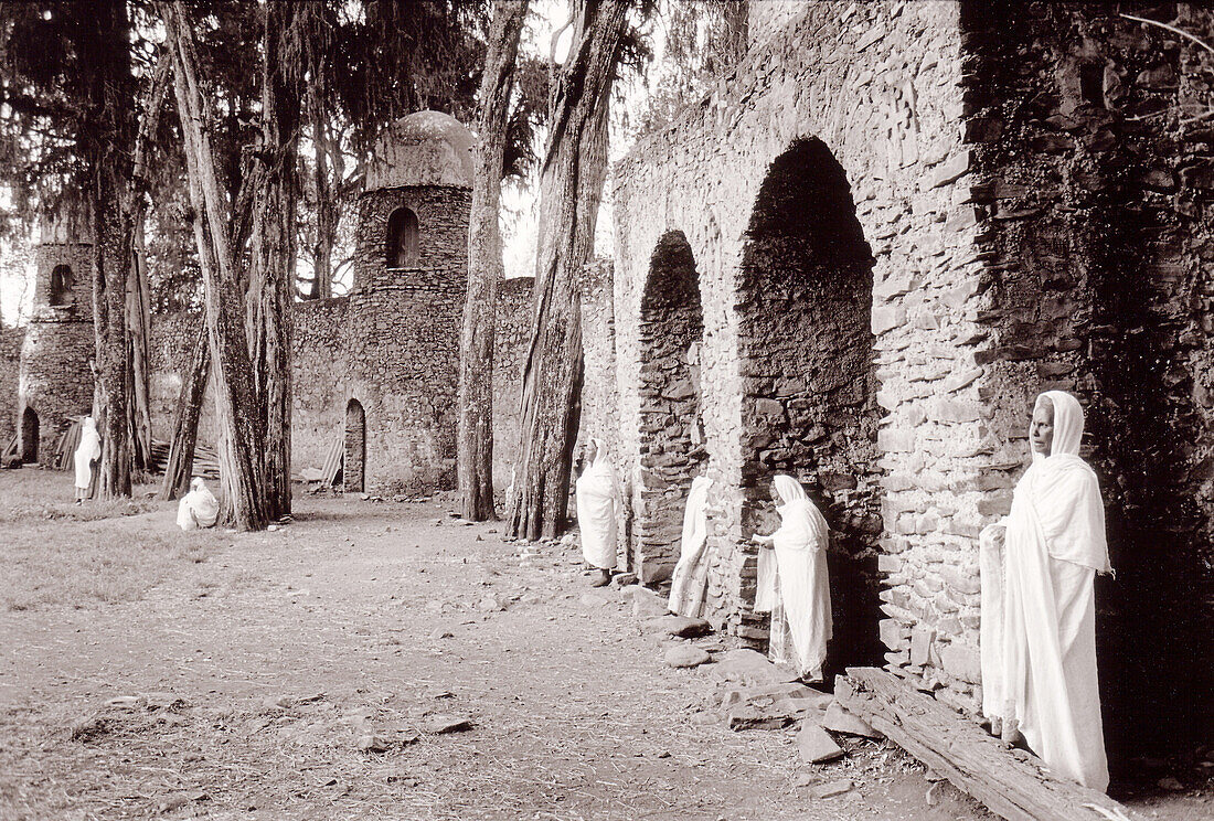 Women praying at the old fortress of Gondar. Ethiopia