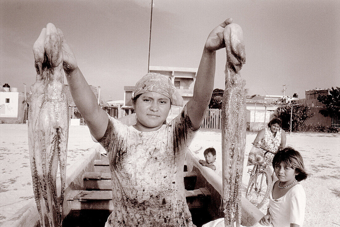 Children with octopuses. Celestun. Yucatan. Mexico