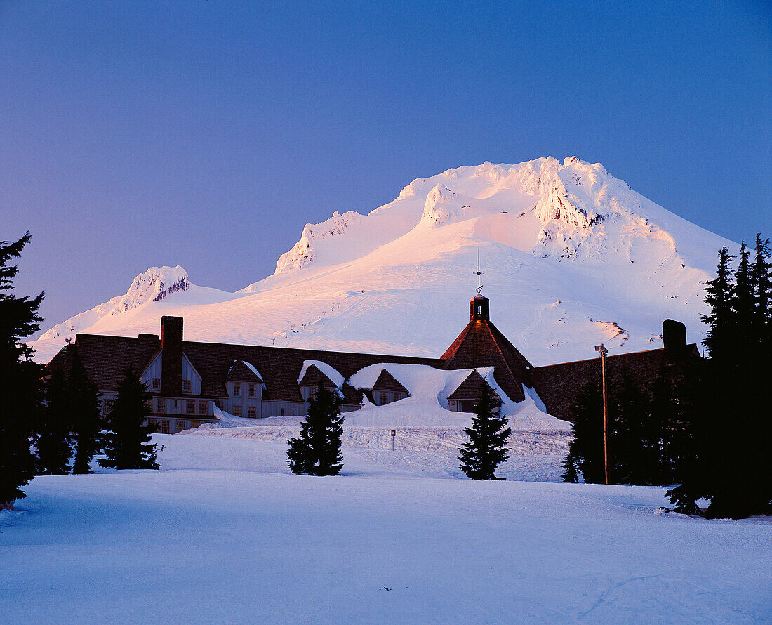 Mount Hood in winter sunset above historic timberline lodge. Mount Hood National Forest. Oregon. USA