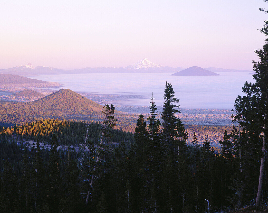 Three Fingered Jack and Mount Jefferson, Oregon Cascades at sunrise. Deschutes National Forest. Oregon. USA