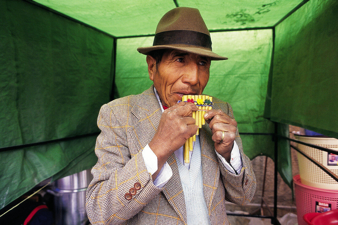 Cicus (typical Andean instrument) maker in a fair. Potosí. Bolivia