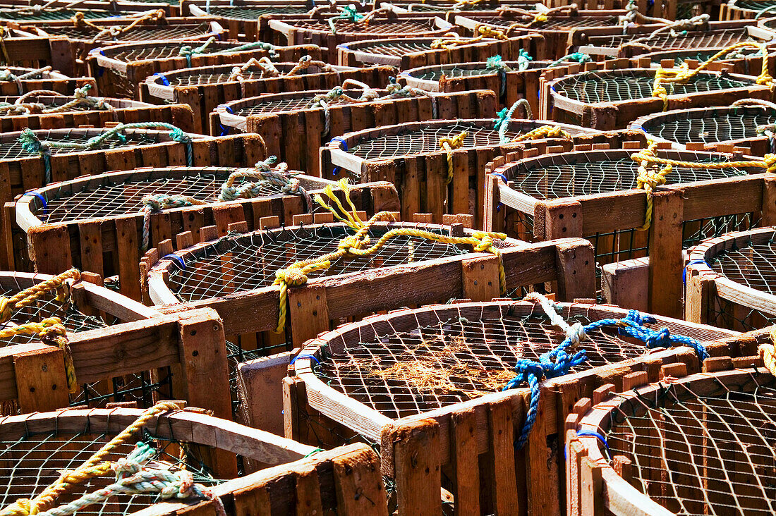 Lobster traps stacked up on dock, Canada