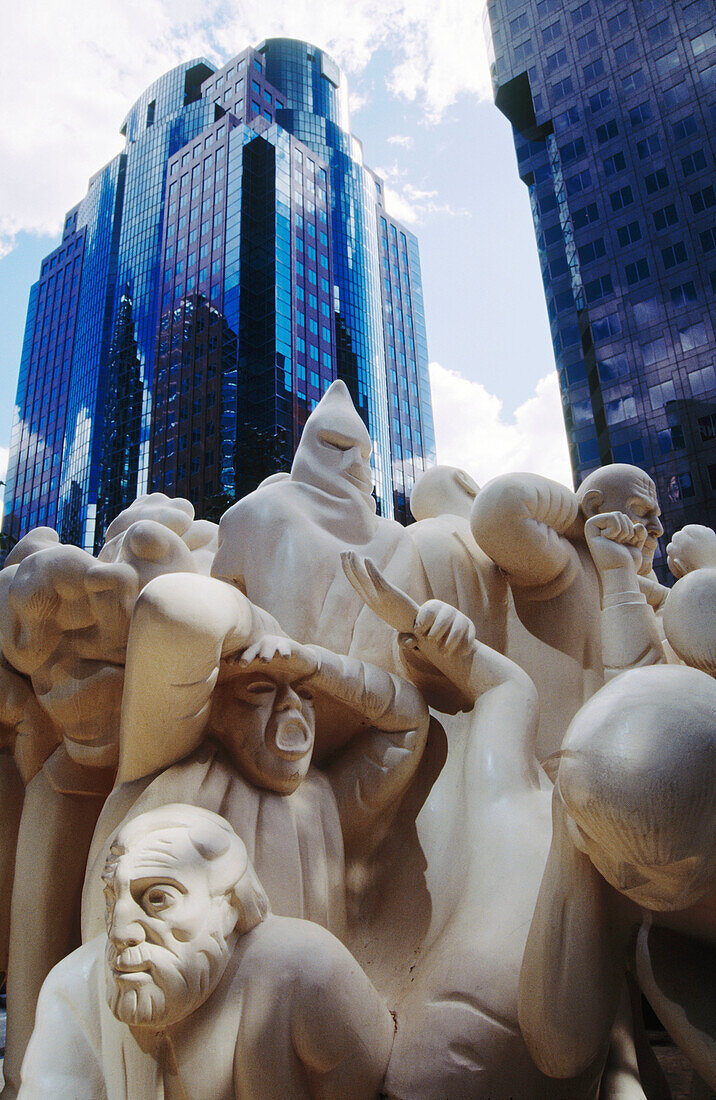 The Iluminated Crowd , sculpture by Raymond Mason at the esplanade of the twin towers complex of BNP Tower and Laurentian Bank Tower. Montreal. Canada