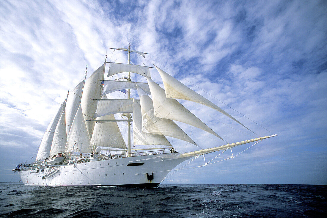 Twenty-one sail clipper ship Star Clipper in full sail on the Caribbean waters off Honduras, Central America