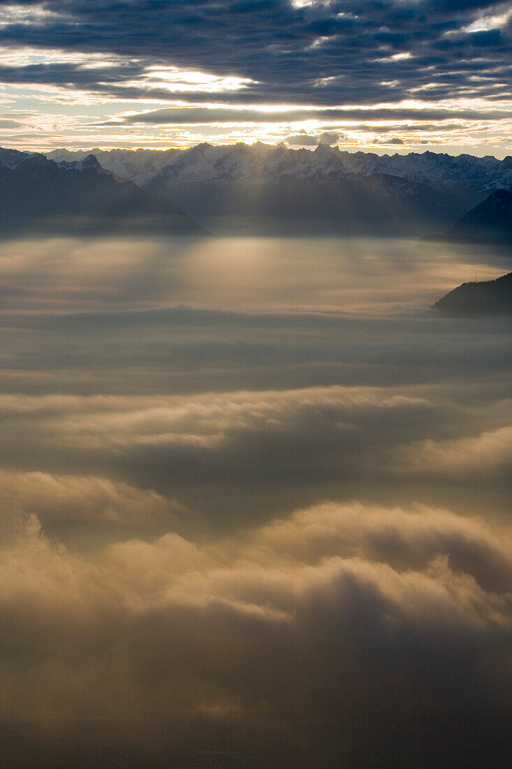 Rising sun over the cloud covered Valley of the Rhein, Rheintal, Switzerland