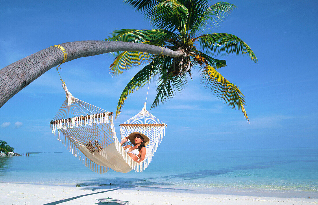 Woman on a hammock. Ari Atoll, Maldives