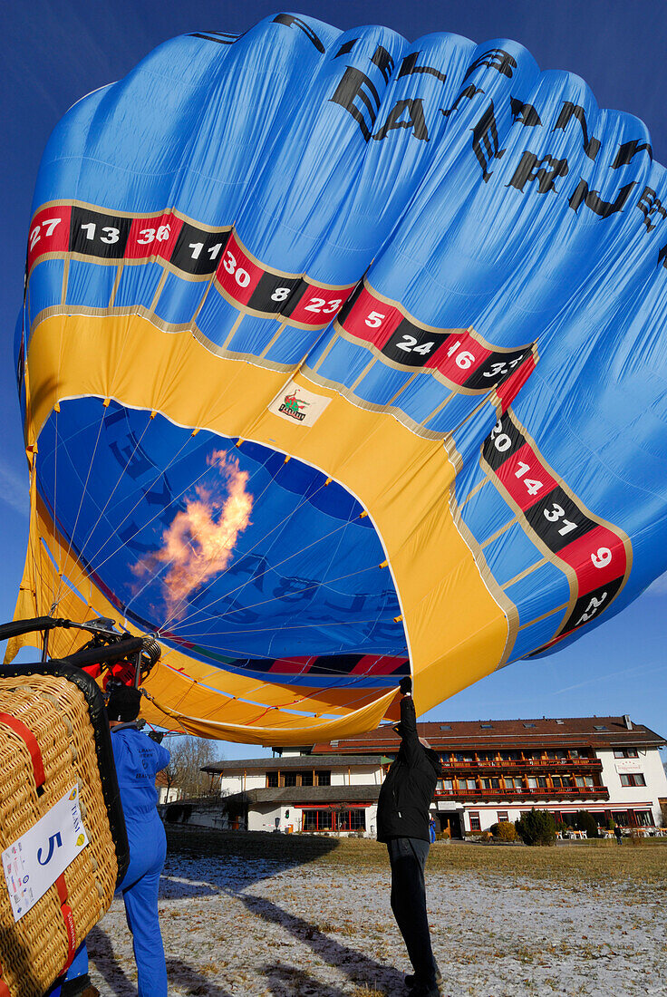 take-off of balloon, heating of the hot air balloon, Montgolfiade in Bad Wiessee at lake Tegernsee, Upper Bavaria, Bavaria, Germany