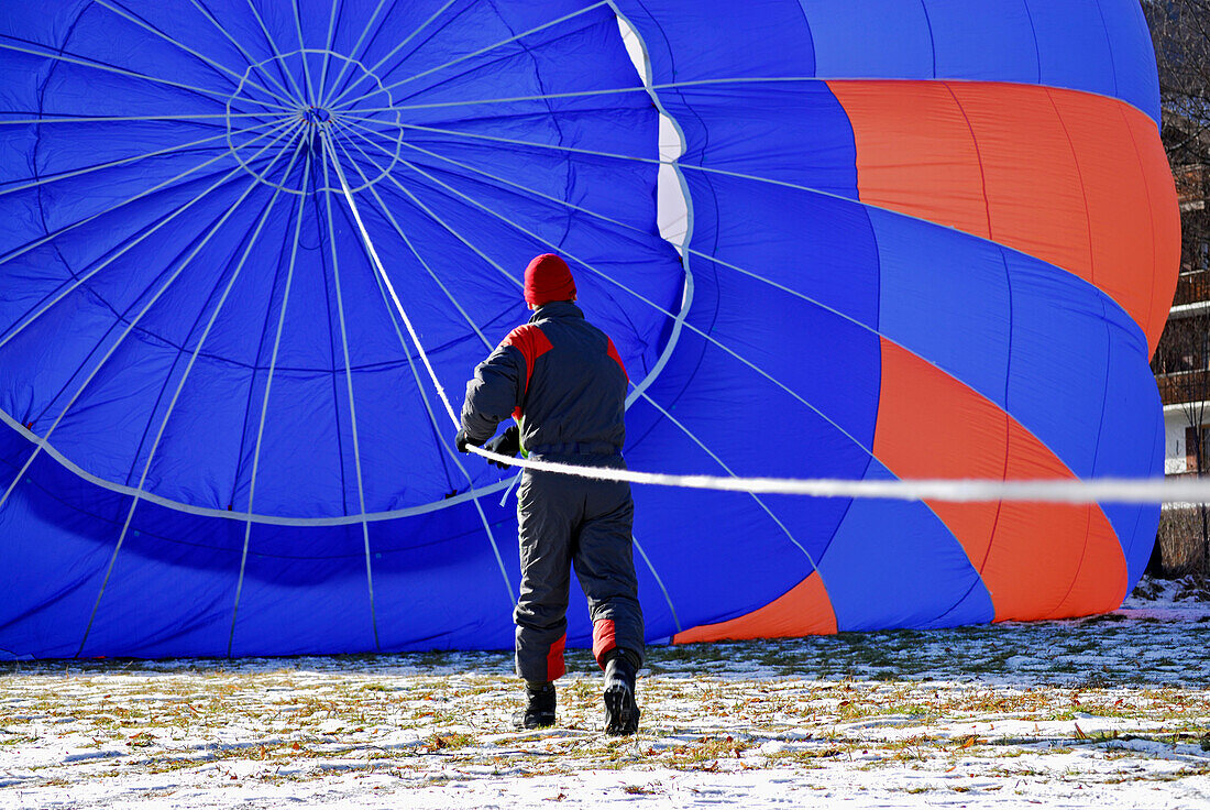 Preparations for take-off of hot-air balloon, Bad Wiessee at lake Tegernsee, Bavaria, Germany