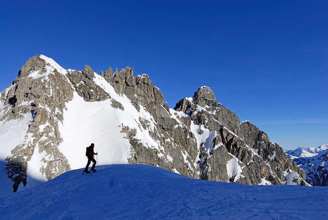 Backcountry skier against mountain scenery, Kleinwalsertal, Allgaeu Alps, Vorarlberg, Austria