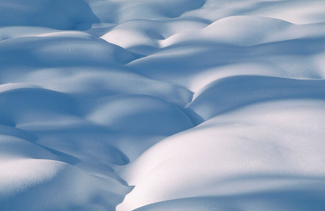 Snow patterns: shadows and light on mounds of snow. Walden. Ontario, Canada