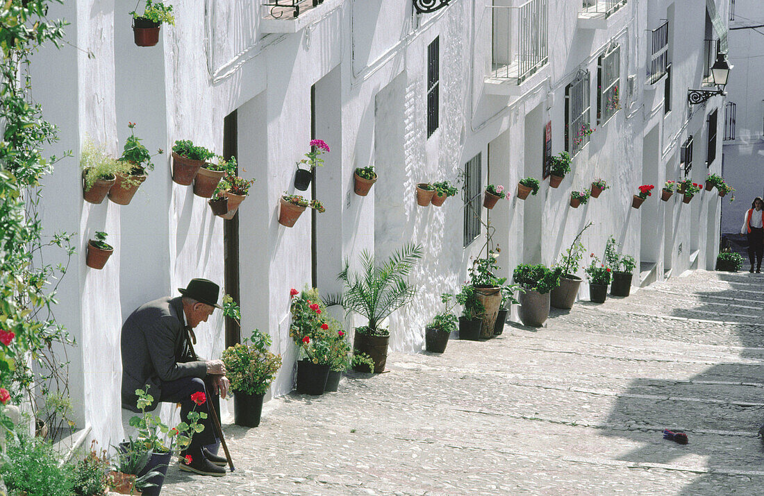 A typical street of Frigiliana in Axarqía. Malaga province. Andalusia. Spain