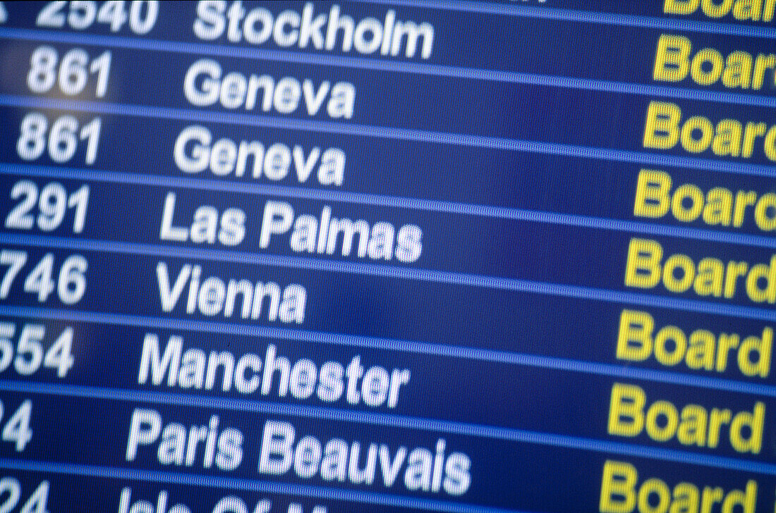 Monitor showing flight arrivals and departures. Heathrow International Airport. London. England. UK.