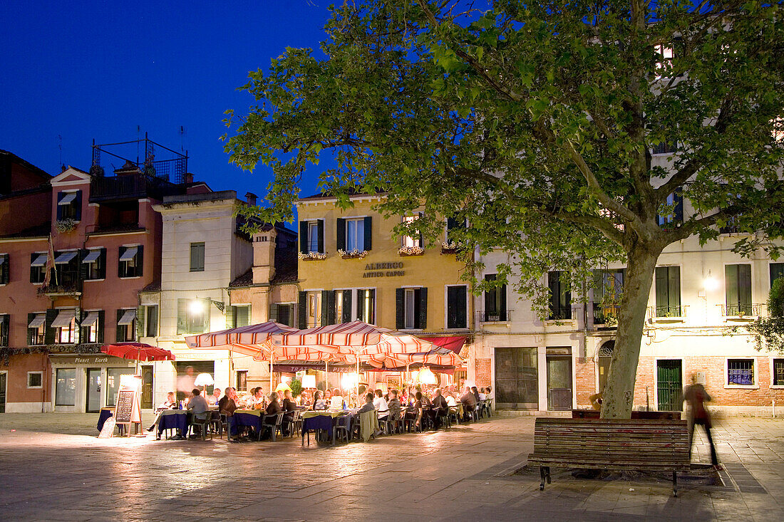 People sitting outside a restaurant bar, Campo Santa Margherita, Venice, Veneto, Italy
