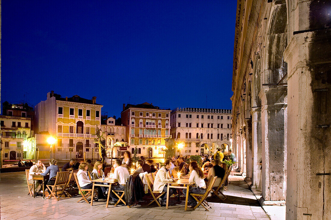 People sitting outside Restaurant Banco Giro in the evening, Venice, Veneto, Italy