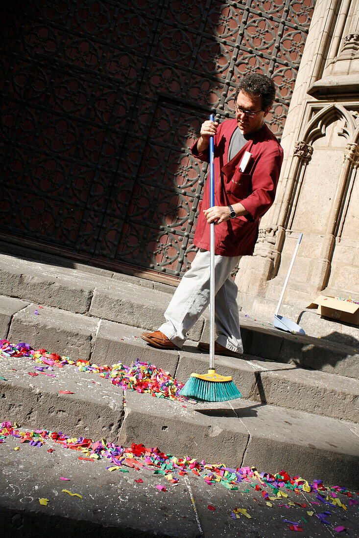 Man swept confetti, Santa Maria del Mar, El Born, Barcelona, Catalonia, Spain