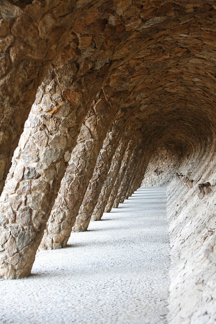 Colonnaded footpath, Antoni Gaudí's Parc Guell, Barcelona, Catalonia, Spain