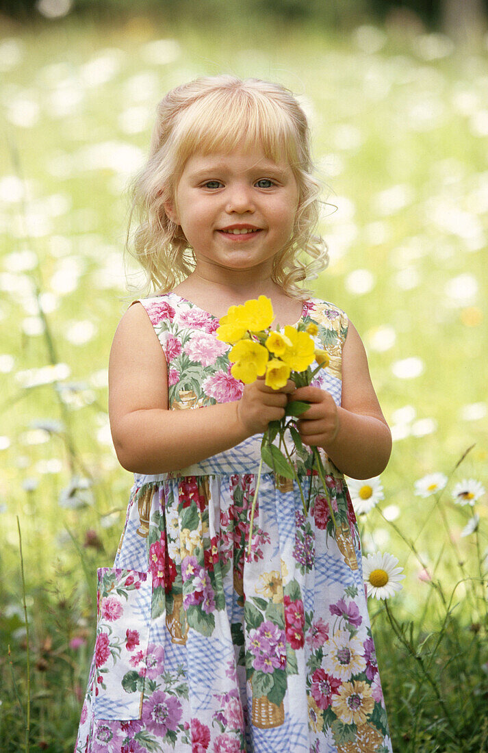 Little girl with bouquet of flowers