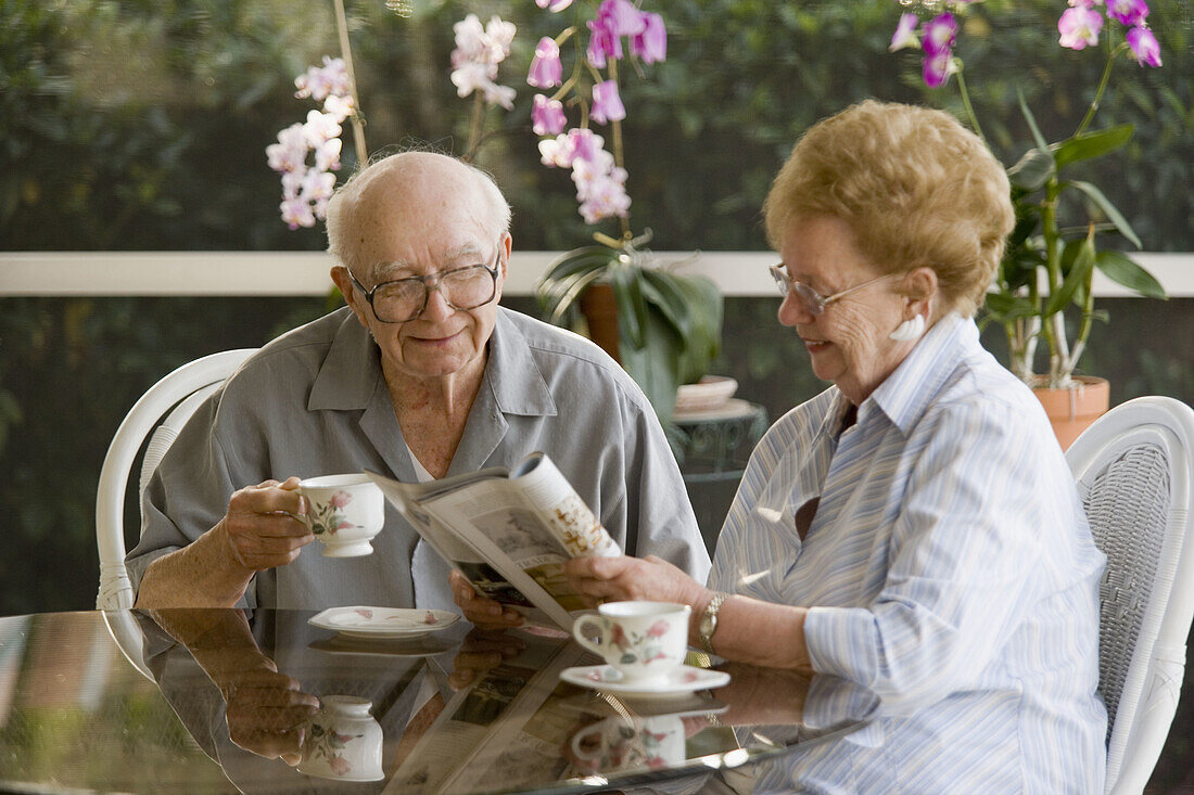 Senior couple having coffee or tea together
