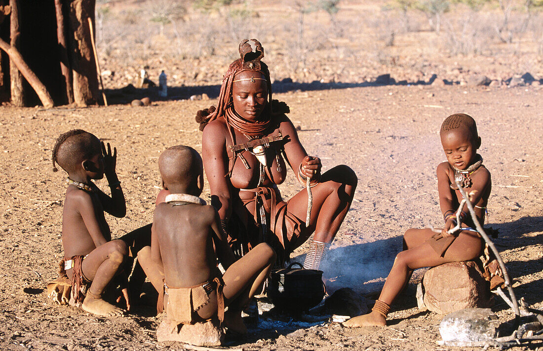 Himba wife with children. Kaokoveld. Namibia.