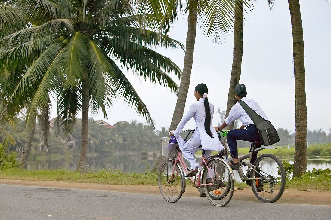 Students on bicycles near Hoi An.
