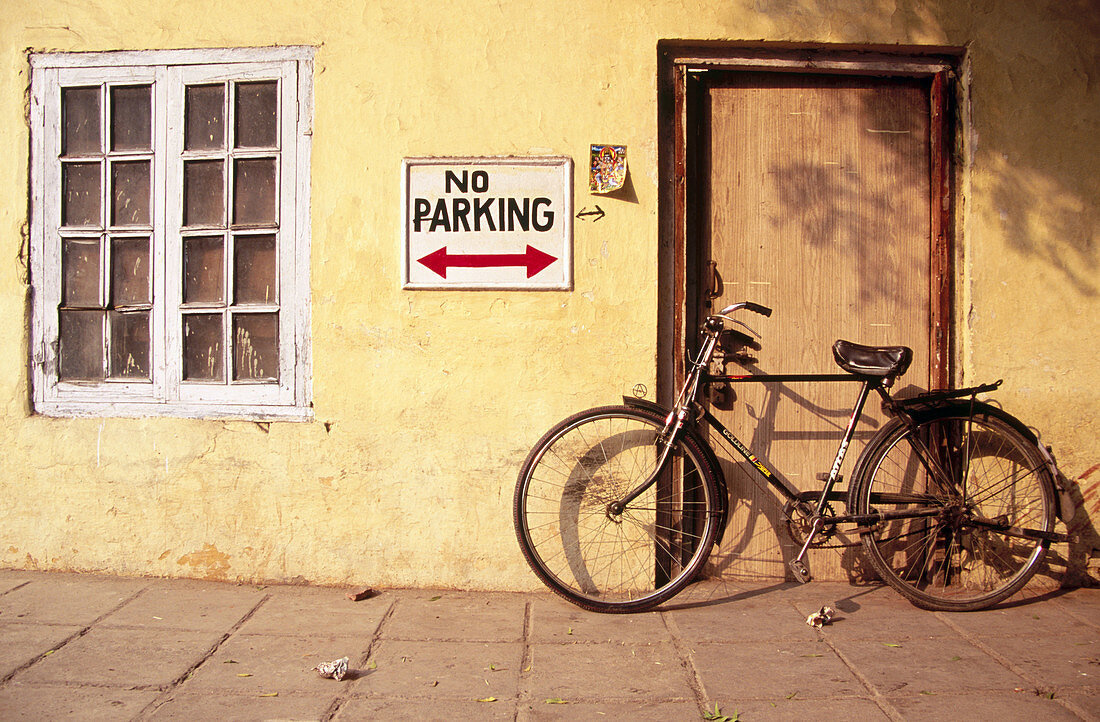 Bicycle and window. New Delhi, India