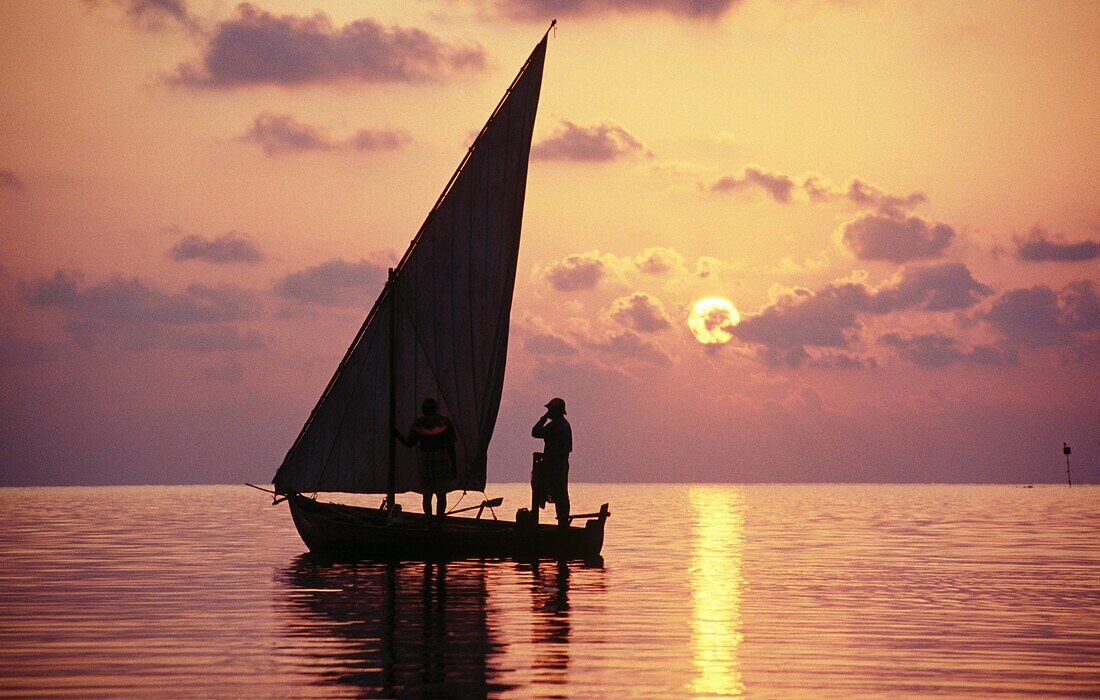 Dhoni (maldivian boat) at sunset. Meerufenfushi Island. North Male Atoll. Maldives