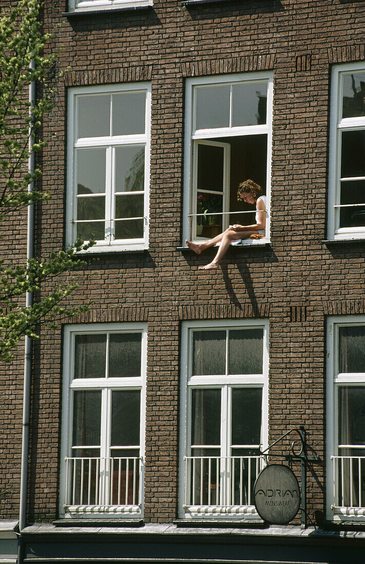 Woman in Window. Amsterdam, Holland