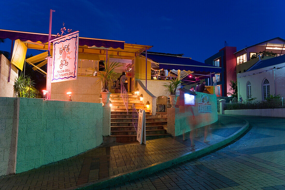 Exterior view of restaurant Cafe Sol at night, St. Lawrence Gap, Barbados, Caribbean