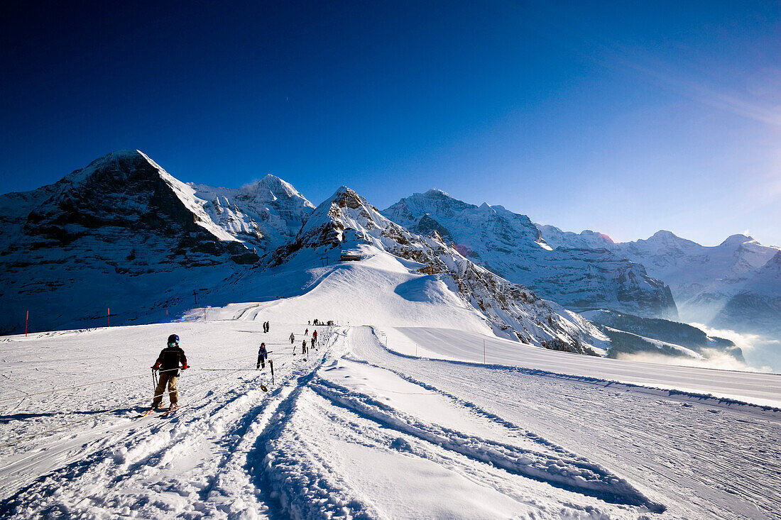 Ski school, Eiger, Moench and Jungfrau in background, Maennlichen, Grindelwald, Bernese Oberland, Canton of Bern, Switzerland