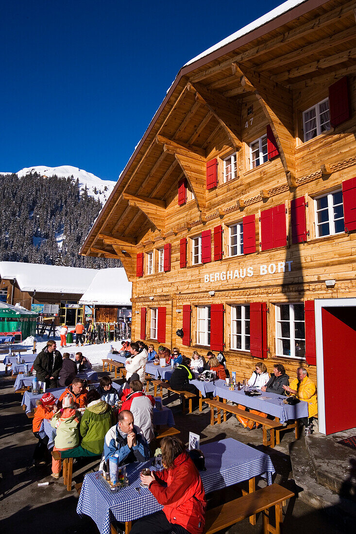 Guests resting on terrace of the mountain restaurant Bort, First, Grindelwald, Bernese Oberland, Canton of Bern, Switzerland