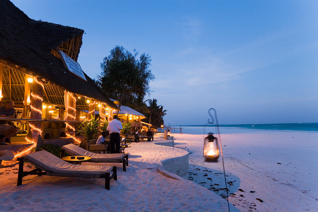 Sunlougers and beach bar in the evening, The Sands, at Nomad, Diani Beach, Kenya