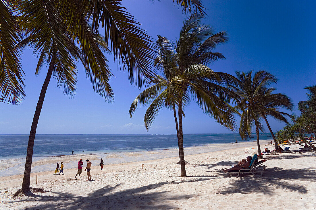 Tourists relaxing at Shanzu beach, Coast, Kenya