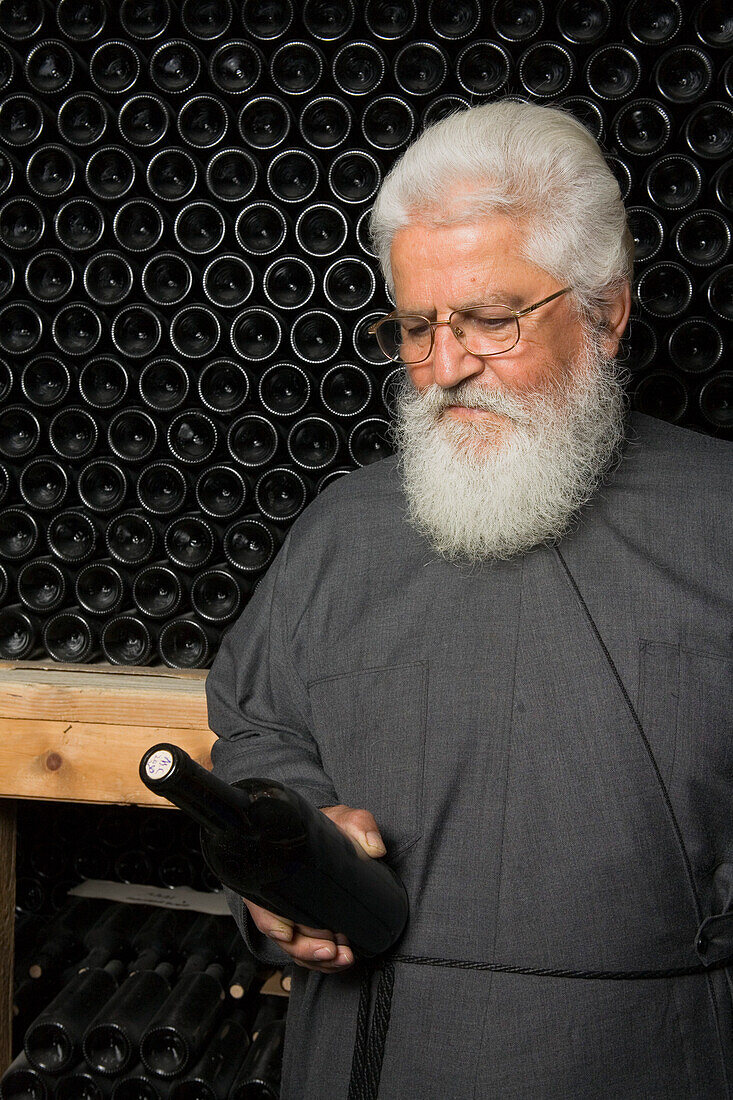 Father Dionysos in a wine cellar, winery, Chrysorrogiatissa monastery, Troodos mountains, South Cyprus, Cyprus
