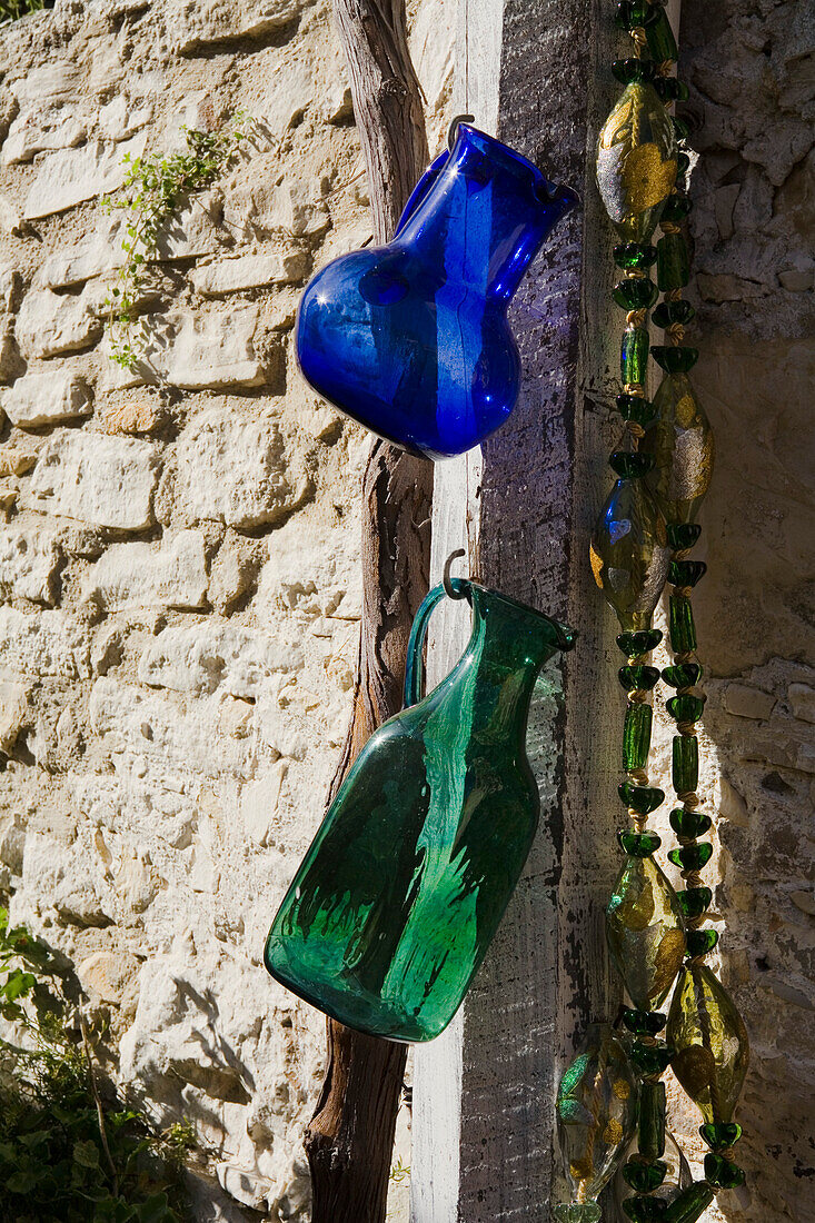 Handmade glass hung up outside a shop, glass craftsman, glassblower Demetris Psilogenis, Omodos village, Troodos mountains, South Cyprus, Cyprus