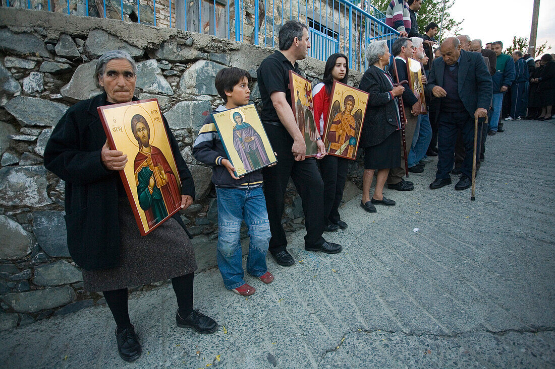 People holding icons at a procession, Orthodox icon procession, Agros, Troodos mountains, South Cyprus, Cyprus