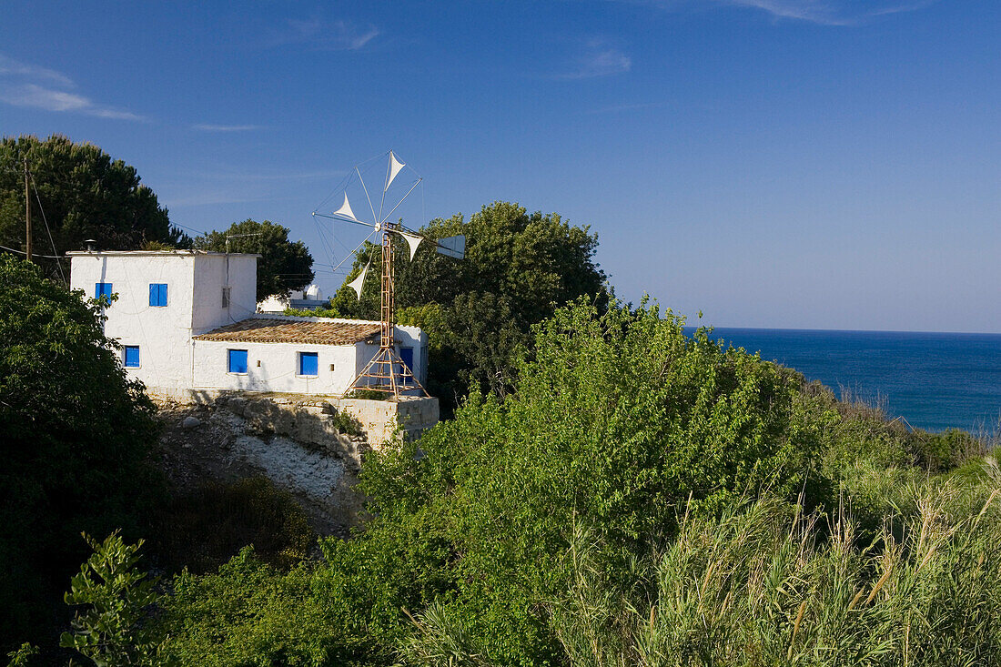Villa, house on the coast with windmill, Akamas Nature Reserve Park, South Cyprus, Cyprus