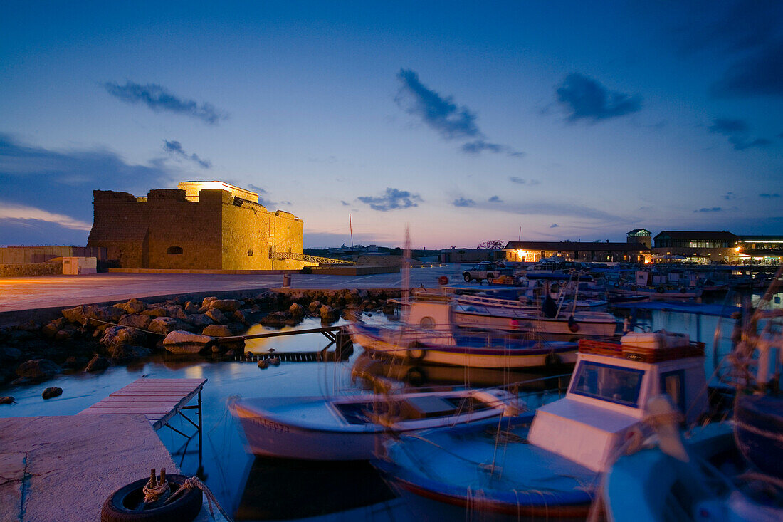 Paphos Castle at night with fishing boats, Paphos harbour, Paphos, South Cyprus, Cyprus