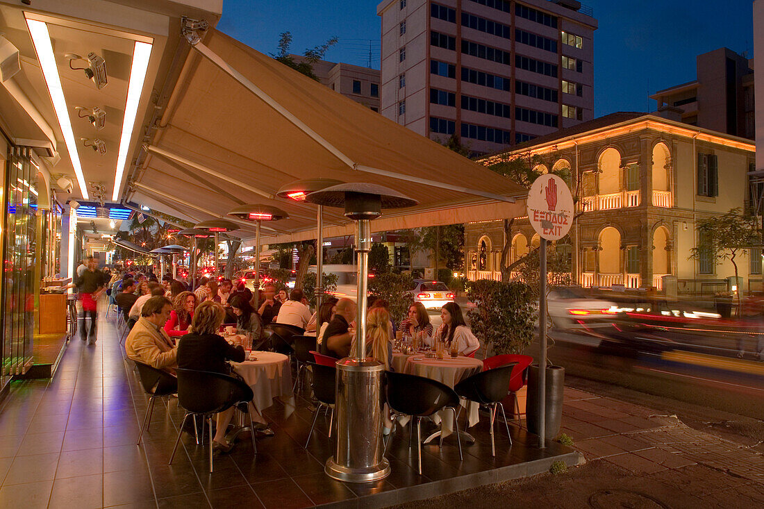 People sitting in an outdoor cafe in the evening, Archiepiskopou Makariou Street, nightlife, Lefkosia, Nicosia, South Cyprus, Cyprus