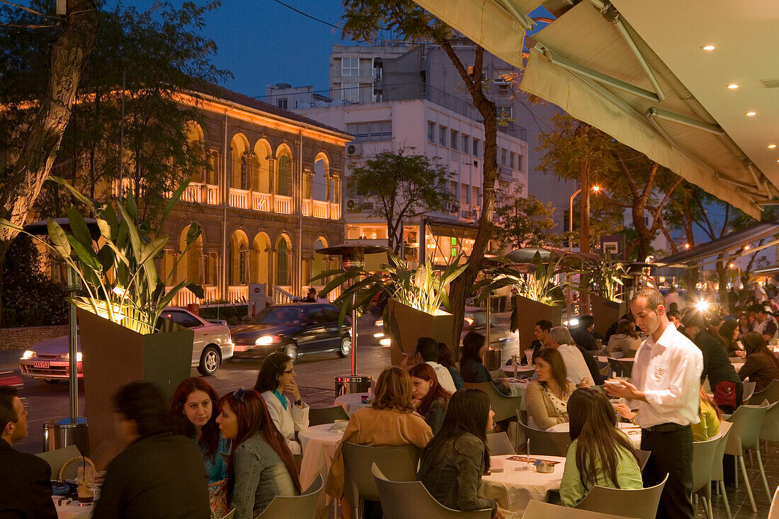 People sitting in an outdoor cafe in the evening, Archiepiskopou Makariou Street, nightlife, Lefkosia, Nicosia, South Cyprus, Cyprus