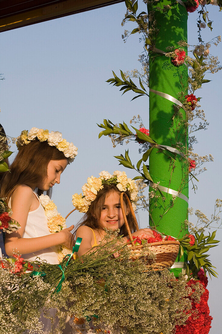 Two young girls at the Anthesteria Flower Festival, parade, Germasogeia, Limassol, South Cyprus, Cyprus
