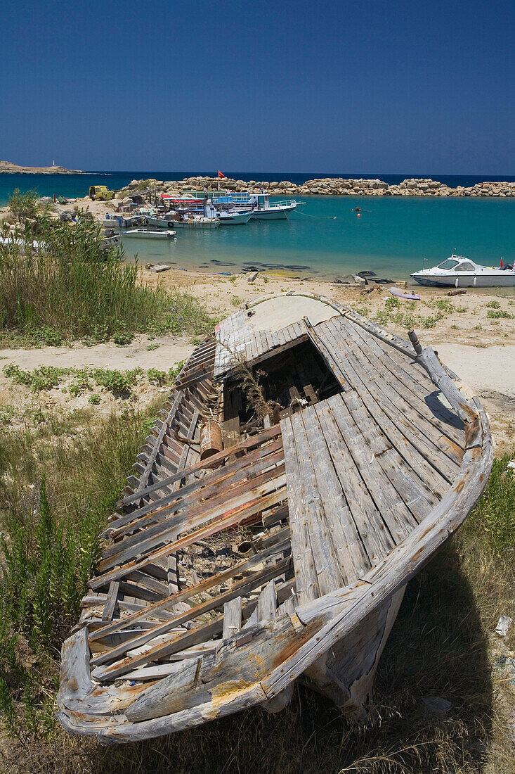 Wreckage of a boat, small fishing port with fishing boats, Erenkoy, Gialousa, Dipkarpaz, Rizokarpaso, Karpasia, Karpass Peninsula, Cyprus