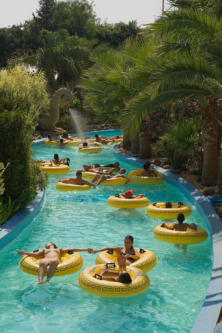 People floating in rubber tyres, WaterWorld, waterpark, Agia Napa, South Cyprus, Cyprus