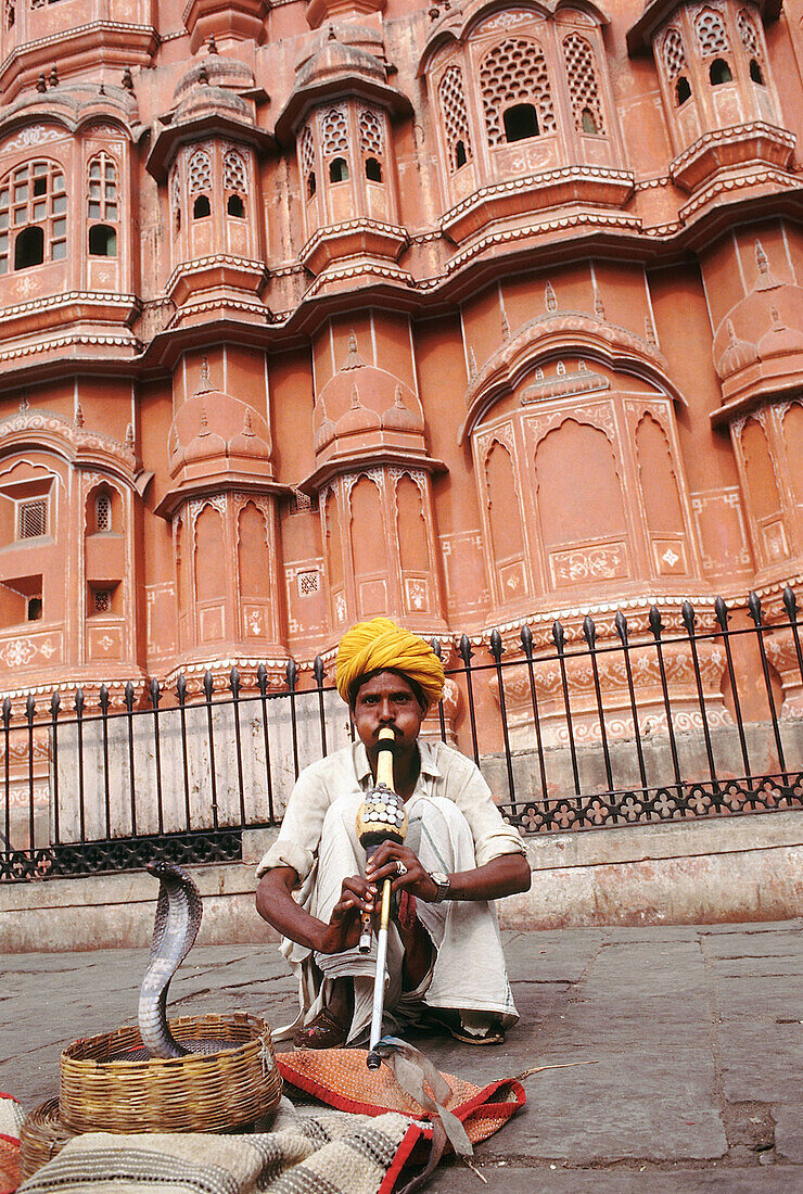 A snake charmer near the Hawa Mahal. Jaipur, Rajasthan, India.