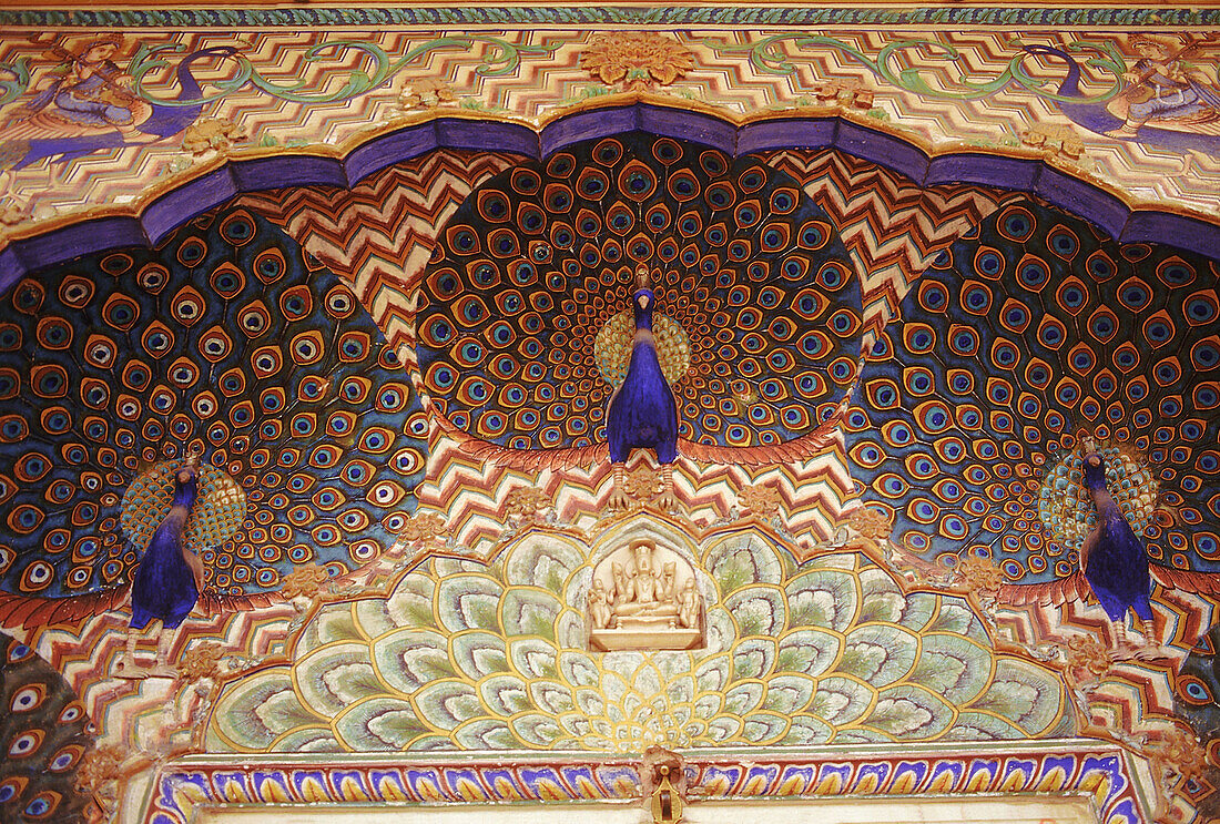 Peacock motifs embossed on the peacock door of the City Palace. Jaipur, Rajasthan, India.