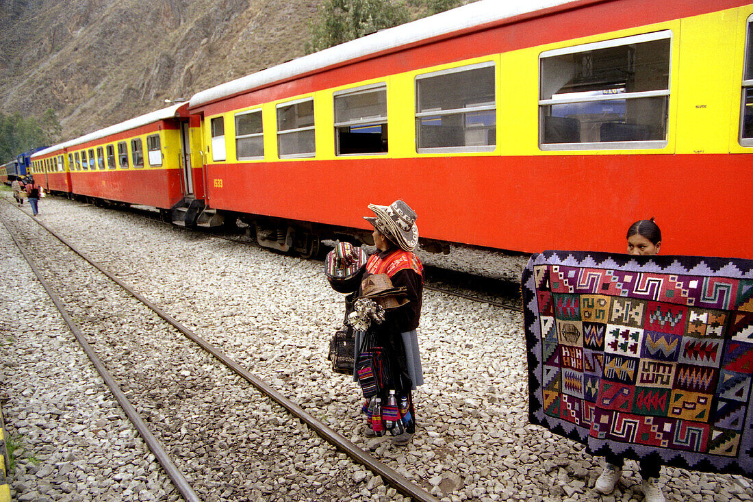 Women in front of train to Machu Picchu. Peru
