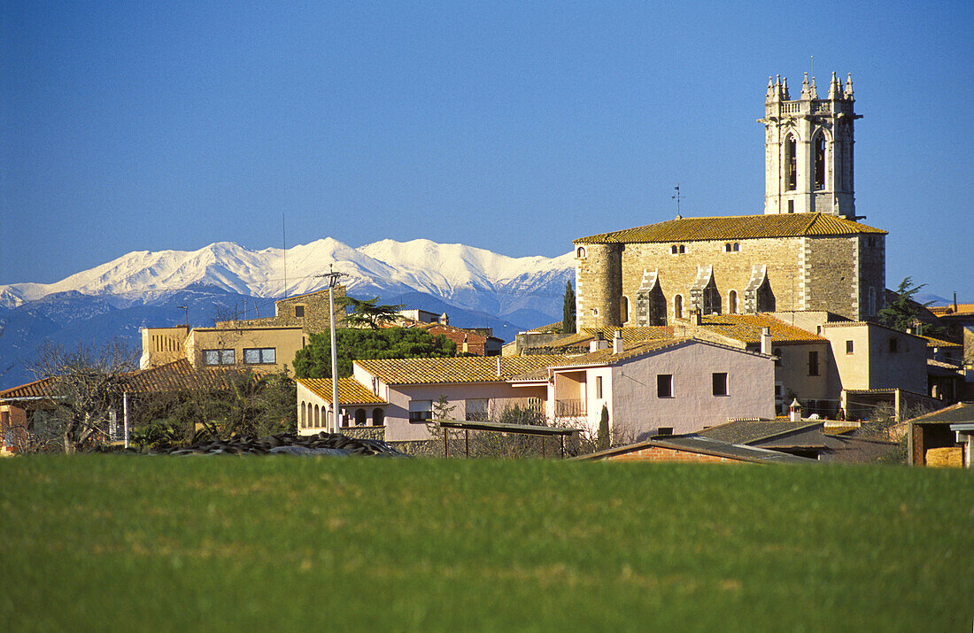Púbol in winter with Pyrenees mountains in background, La Pera. Baix Empordá, Girona province, Spain